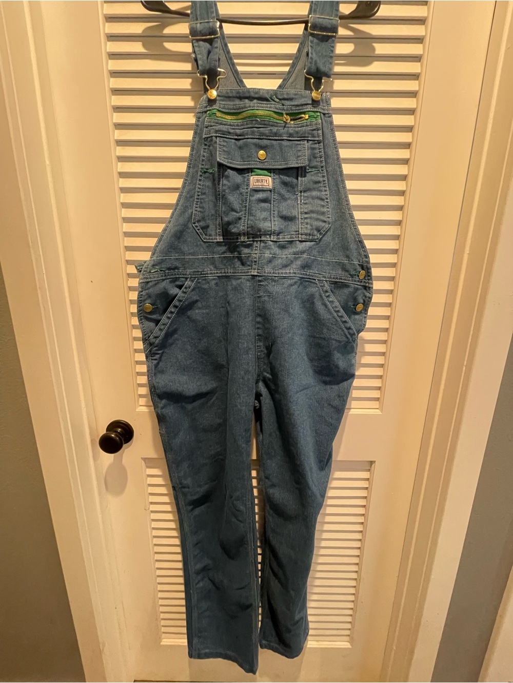 Liberty Women’s overall denim with front pocket.